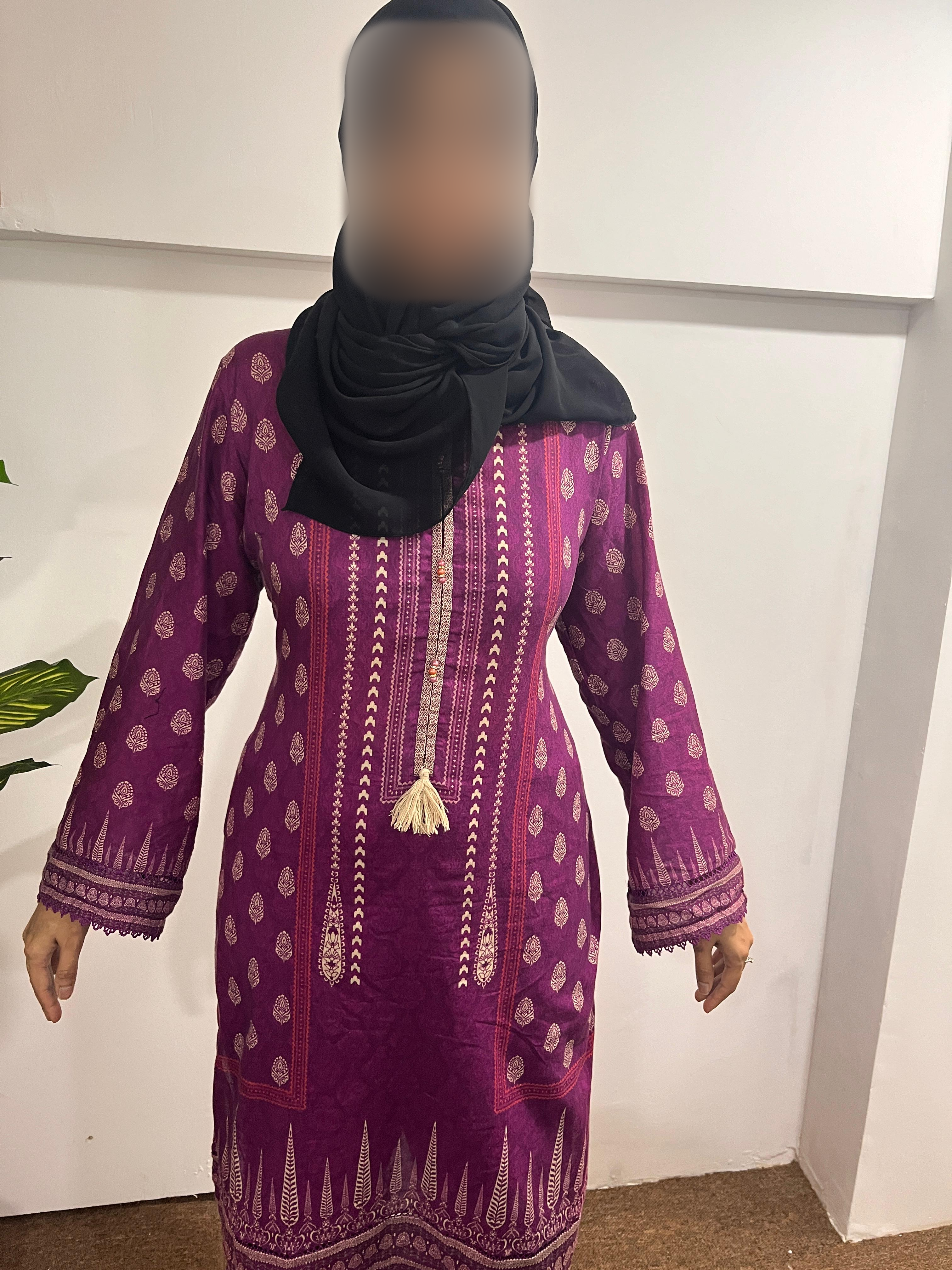 After: client in a purple outfit, with her face blurred for privacy.